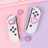 Front view of the Pusheen Nintendo Thumb Grip Caps. Two caps feature Pusheen the Cat's blushing face and two feature classic Pusheen icons including a heart and shooting star.