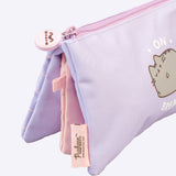 Side view of the 3-compartment case. The outer pockets are light purple while the inner pouch is light pink. The zipper has a silicone pull tab featuring a graphic of Pusheen the Cat's face.