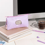 Pusheen On Break Accessory Case sits atop a desktop. The purple case has three compartments that are all accessible through the top zipper.
