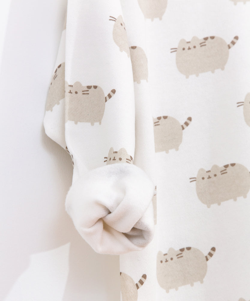 Close-up view of the interior of the tunic top. The all over print Pusheen top has a soft cream-colored interior lining. 