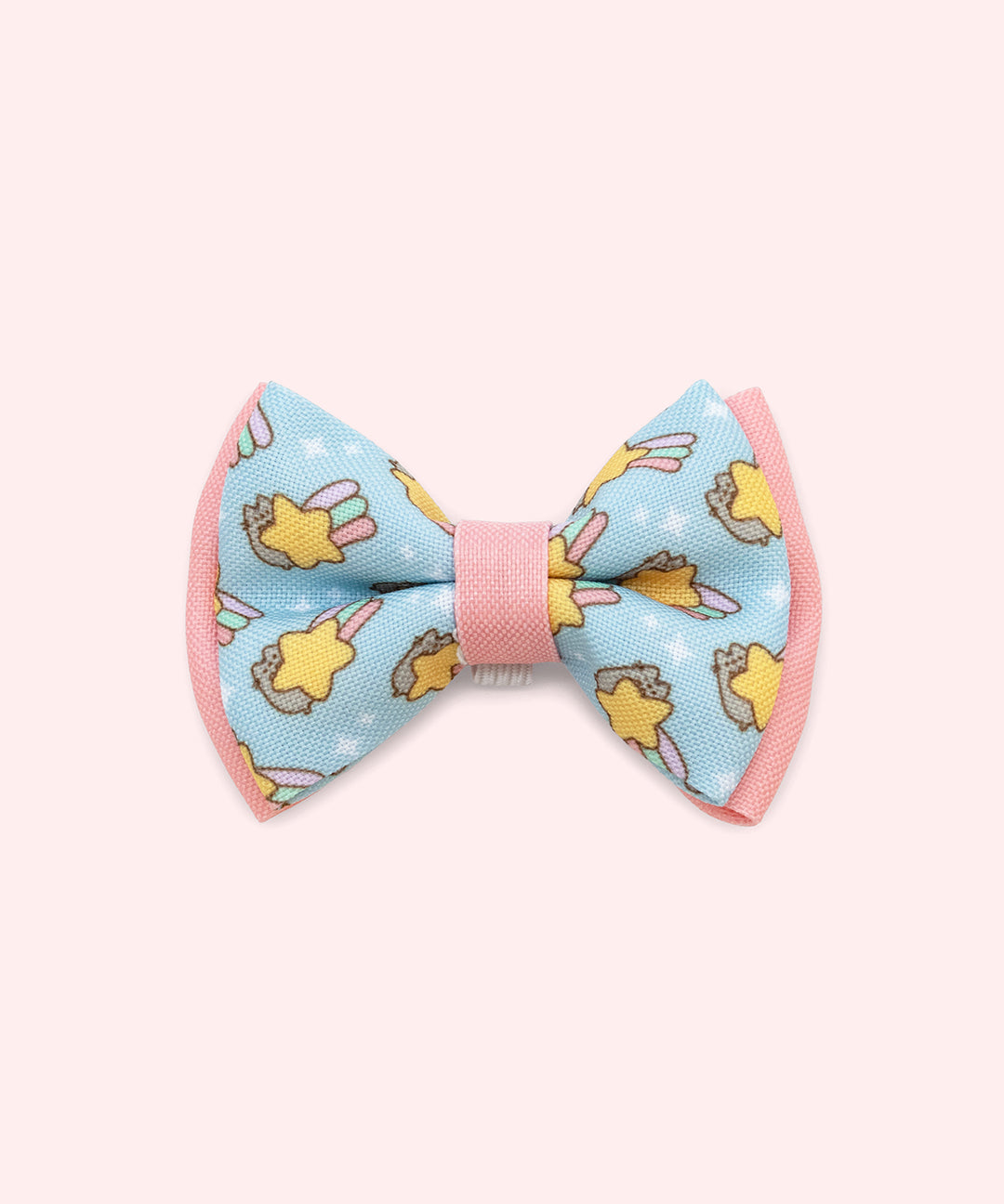 Close-up of the blue bowtie in the Collar Bows 2-pack. The main bowtie background color is blue and has pink piping details. 