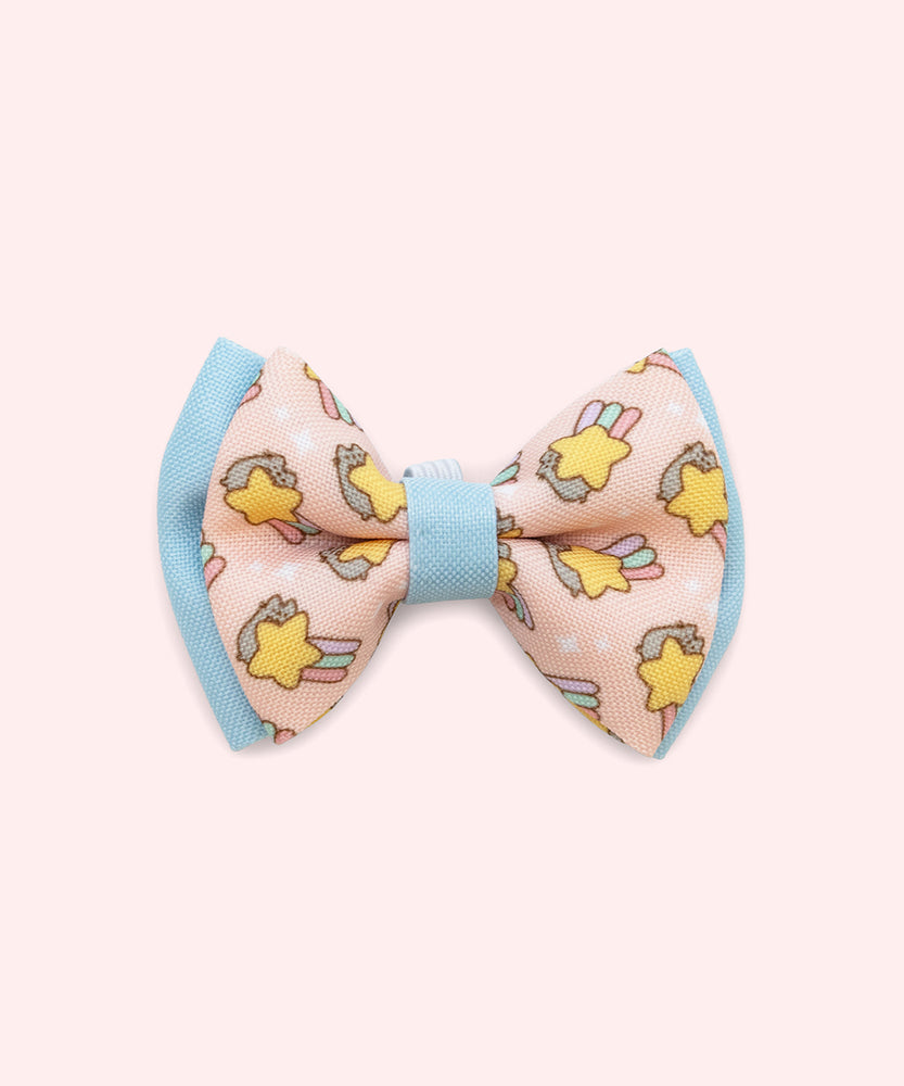 Close-up of the pink bowtie in the Collar Bows 2-pack. The main bowtie background color is pink and has blue piping details. 