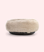 Back view of the round pet bed with fur texture.