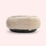 Back view of the round pet bed with fur texture.