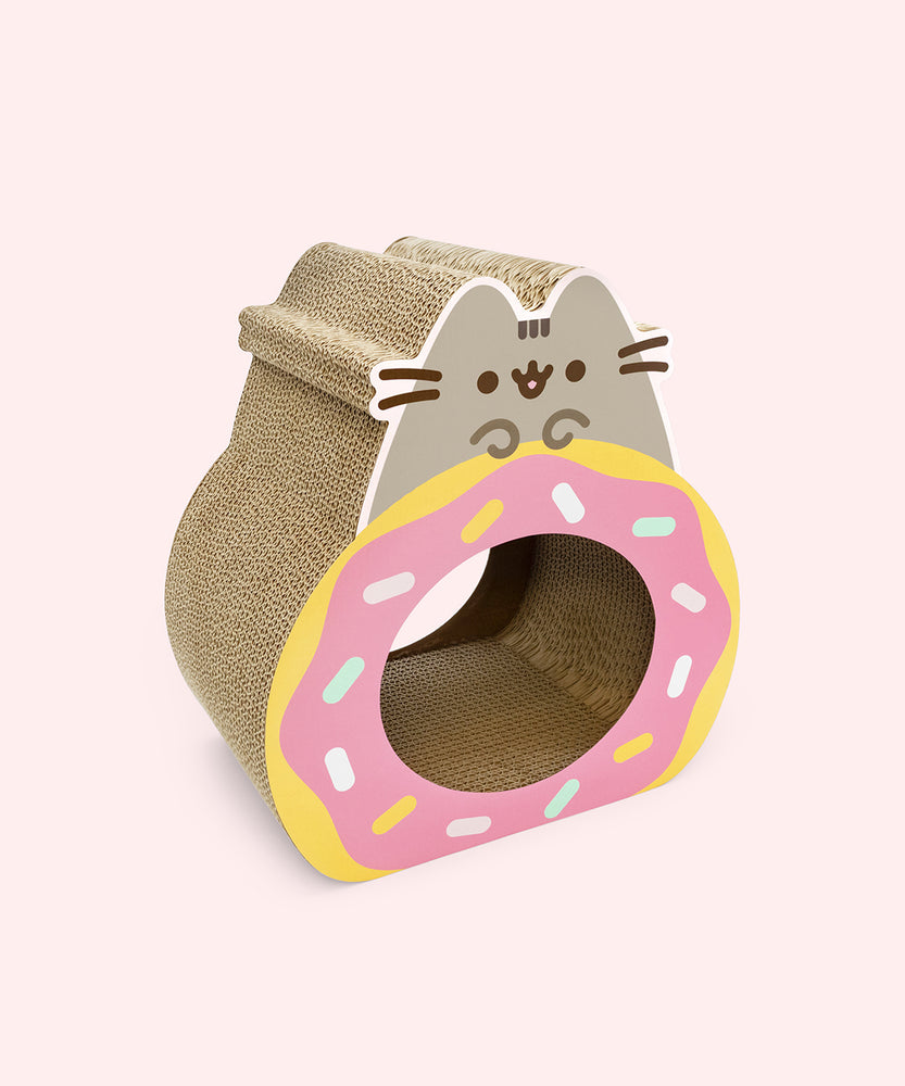 Side view of the Pusheen Pet Donut Scratcher. The cardboard scratcher shows Pusheen the Cat holding a pink glazed donut. 