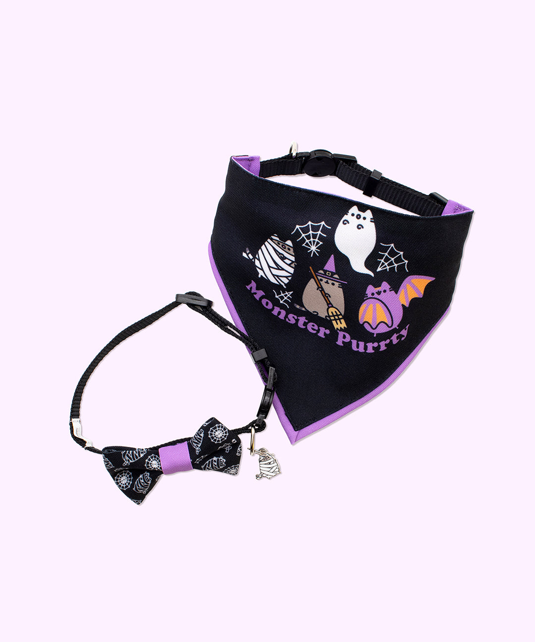 Front view of Pusheen Pet Halloween 2pc. Pet Collar & Bandana Set. The black collar has an attached bowtie with an all over print and a Pusheen Mummy charm. The bandana has a graphic of Mummy Pusheen, Witch Pusheen, Bat Pusheen, and Ghost Pusheen attending a monster party.