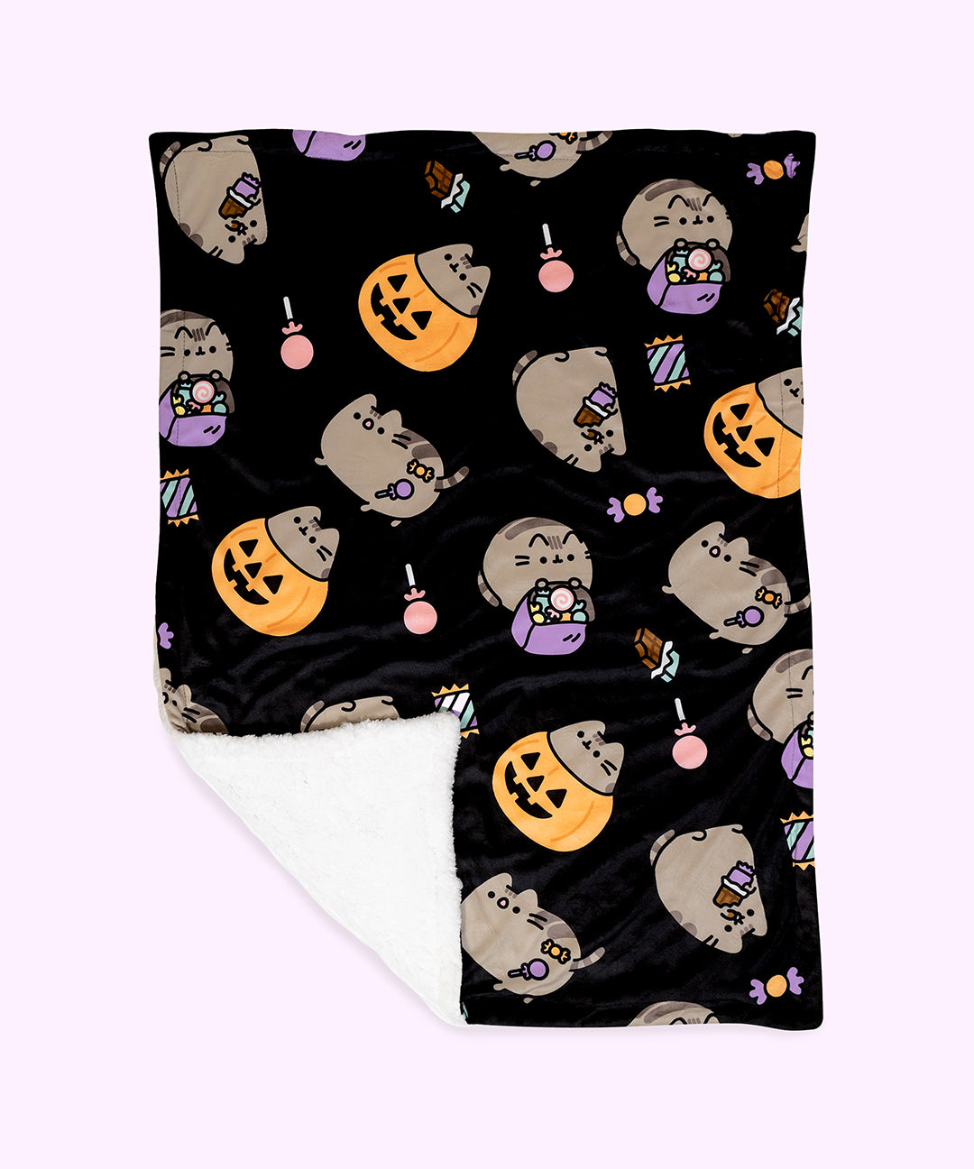 Front view of the Pusheen Pet Halloween Blanket. The micro flannel front side features an all over print of Pusheen taking part in Halloween activities such as trick-or-treating, eating chocolate, getting scared, and sitting in a pumpkin. The grey Pusheen cats are surrounded by chocolates, lollies, and candies.  