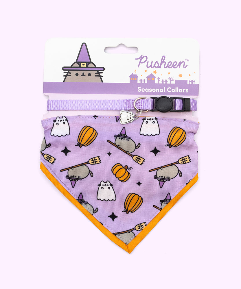 Pusheen Halloween pet collar and bandana set in packaging that states that the set are seasonal collars. The Boosheen charm and bandana pattern are displayed at the front. 