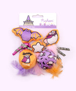 Close-up of the orange and white star plush pet toy with pink feathers attached to the bottom. 