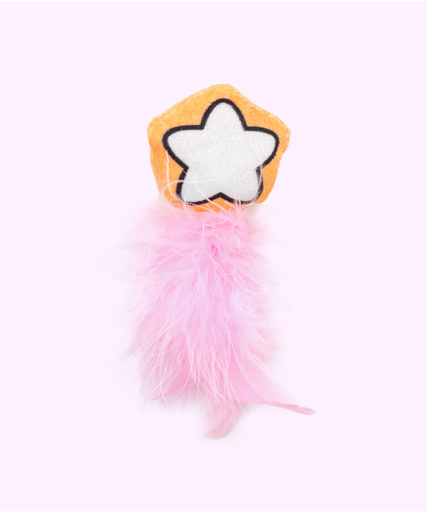 Close-up of the orange and white star plush pet toy with pink feathers attached to the bottom. 