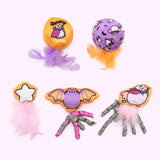 Front view of all plush toys included in the Pusheen Pet Halloween Plush Toys 5-Pack. The set includes two plush balls with feathers and three plush toys with feathers and spirals.