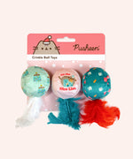 Holiday Pet toys lined up in their packaging that states "Pusheen Crinkle Ball Toys."