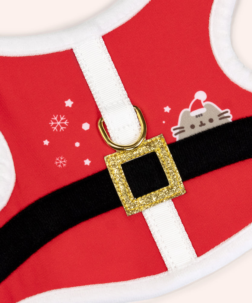 Santa Pet Harness in its Pusheen packaging that says "Holiday Harness" and features a graphic of Pusheen the Cat wearing a red Santa hat.