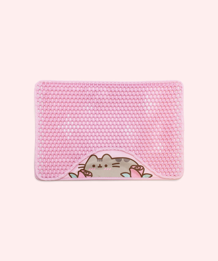 Pink textured litter mat with a design of a blushing Pusheen the Cat with two pink roses.