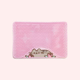 Pink textured litter mat with a design of a blushing Pusheen the Cat with two pink roses.