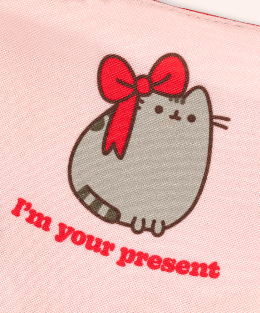 Pusheen Present pet collar and bandana set in packaging that states that the set are seasonal collars. The 3D bow and bandana graphics are displayed at the front. 