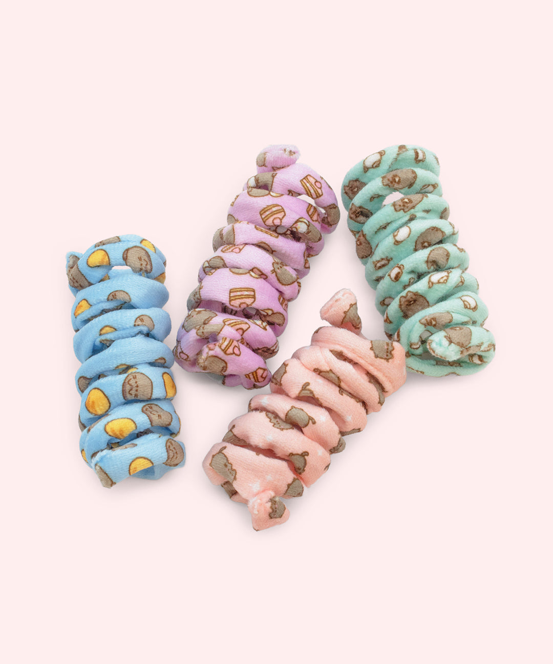 Pusheen Pet Spiral Toys 4-Pack includes blue, purple, pink, and mint green spiral toys with all over patterns of Pusheen and accessories. 