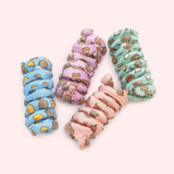 Pusheen Pet Spiral Toys 4-Pack includes blue, purple, pink, and mint green spiral toys with all over patterns of Pusheen and accessories. 