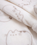 Close-up of plush fabric print. Pusheen the cat's ears, head stripes, eyes, mouth, and whiskers are shown in every pattern.
