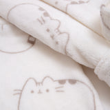 Close-up of plush fabric print. Pusheen the cat's ears, head stripes, eyes, mouth, and whiskers are shown in every pattern.
