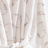 Pusheen Plush Robe hangs on a hanger and shows a close-up of the all over gray cat print on the cream fabric. 