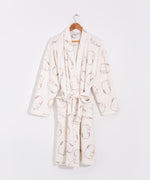 Cream plush robe with all over pattern of a gray outlined Pusheen the Cat lying down.
