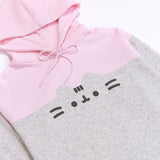 Front view of the Pusheen Relaxed-Fit Character Hoodie lying on a white surface. The two-toned sweatshirt has a light pink hoodie and chest coloring while the sleeves and bottom of the sweatshirt are light heather gray. 