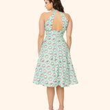Back view of the model wearing the Pusheen Halter Dress. Beneath the halter top, the dress has an align silhouette that falls below the wearer's knees.