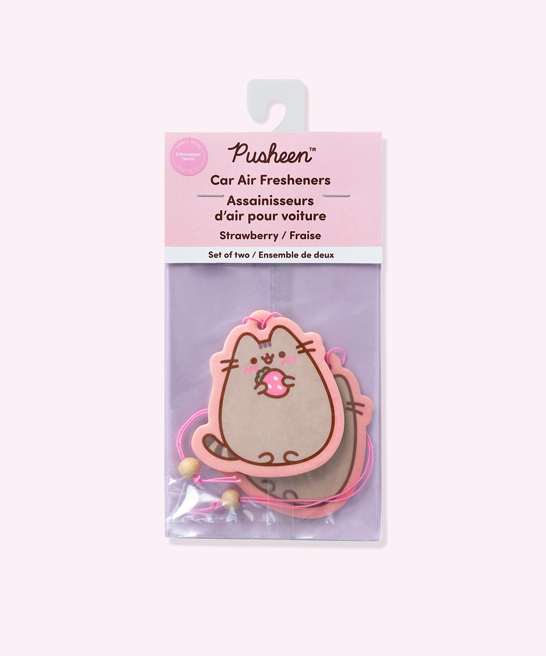 Pusheen car air fresheners 2-pack in their packaging bag. The strawberry car fresheners are held within a clear, pink and purple bag.