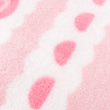 Close-up of the polyester material on the sweet blanket. The border shown features a white scalloped detail with medium pink colored gum drops.