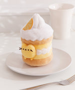 Alternate side quarter view of the Pusheen Sweets Lemon Plush Environment. The white, yellow, and brown plush sits atop a white plate. 