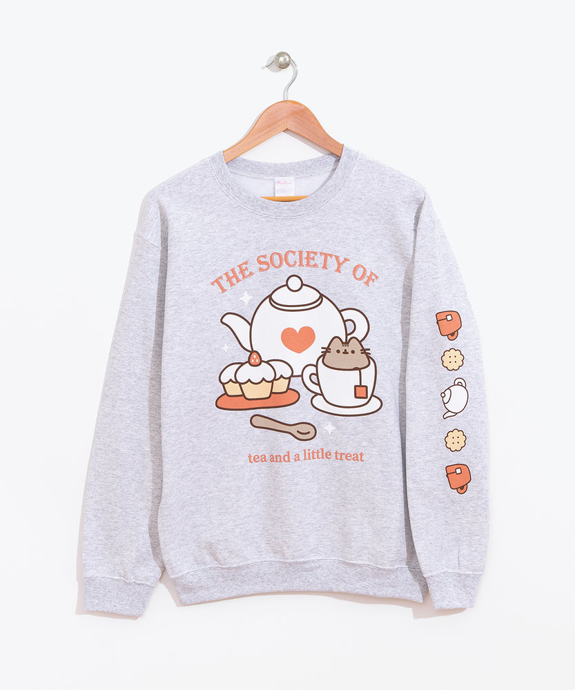 Front view of the Tea Society Unisex Sweatshirt. The light grey sweatshirt hangs on a brown wood hanger to show all collar, sleeve, and hem details. 