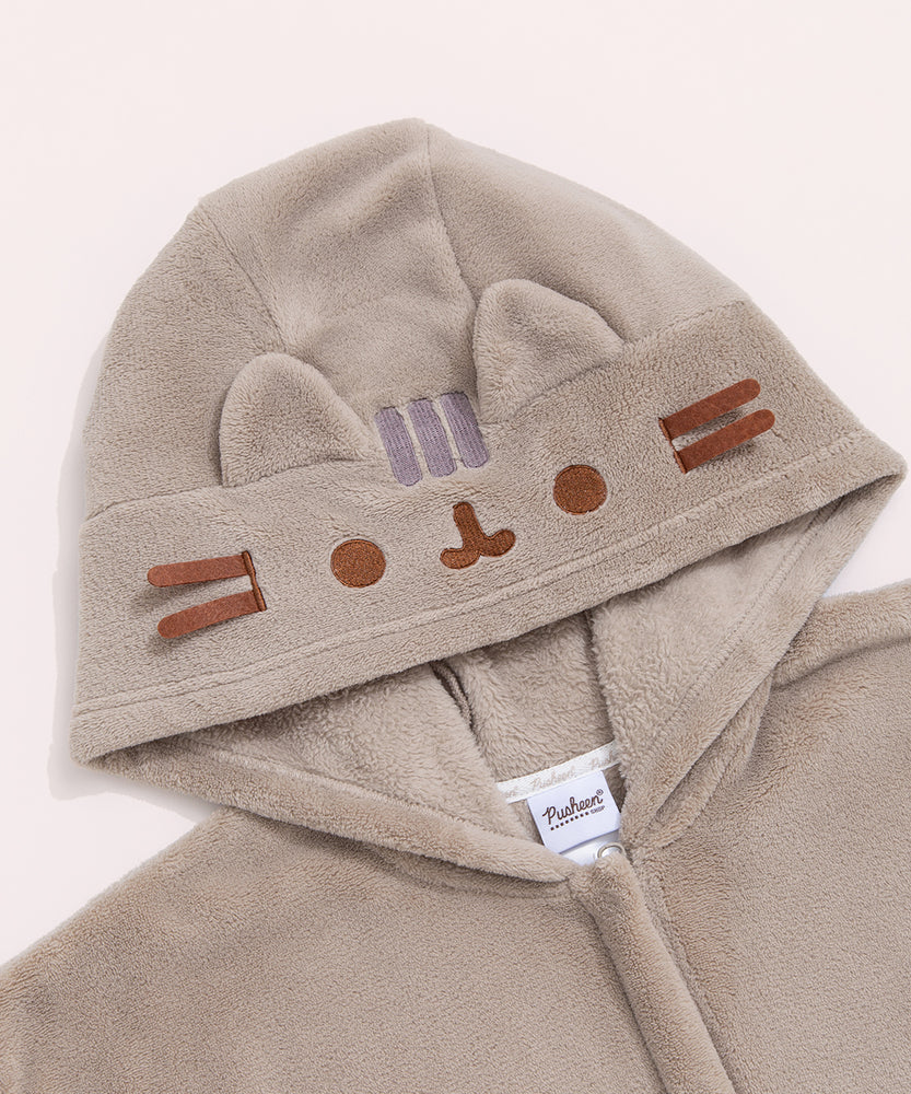Close-up of the hood on the Kigurumi onesie. Pusheen's ears and whiskers are 3D while her head stripes, eyes, and mouth are embroidered in gray and brown.
