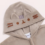 Close-up of the hood on the Kigurumi onesie. Pusheen's ears and whiskers are 3D while her head stripes, eyes, and mouth are embroidered in gray and brown.