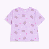 Pusheen Twilight Pajama Top lies on a flat surface. Pusheen the Cat has a grey body and is outlined in light purple and has light purple features.