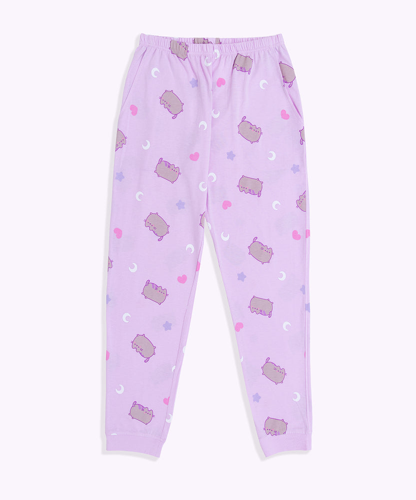 Pusheen Twilight Pajama bottoms lie on a flat surface. The jumping cat is printed all over the lounge bottoms.