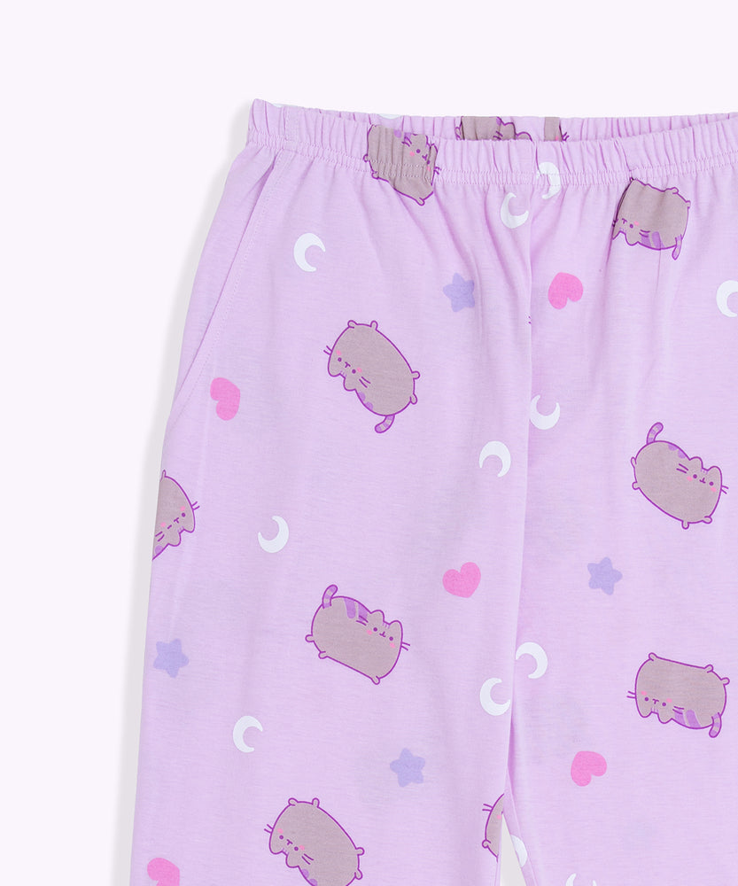 A close-up view of the waistband on the Pusheen pajama pants. The light purple pants have a thin, stretchy waistband and side pockets. 