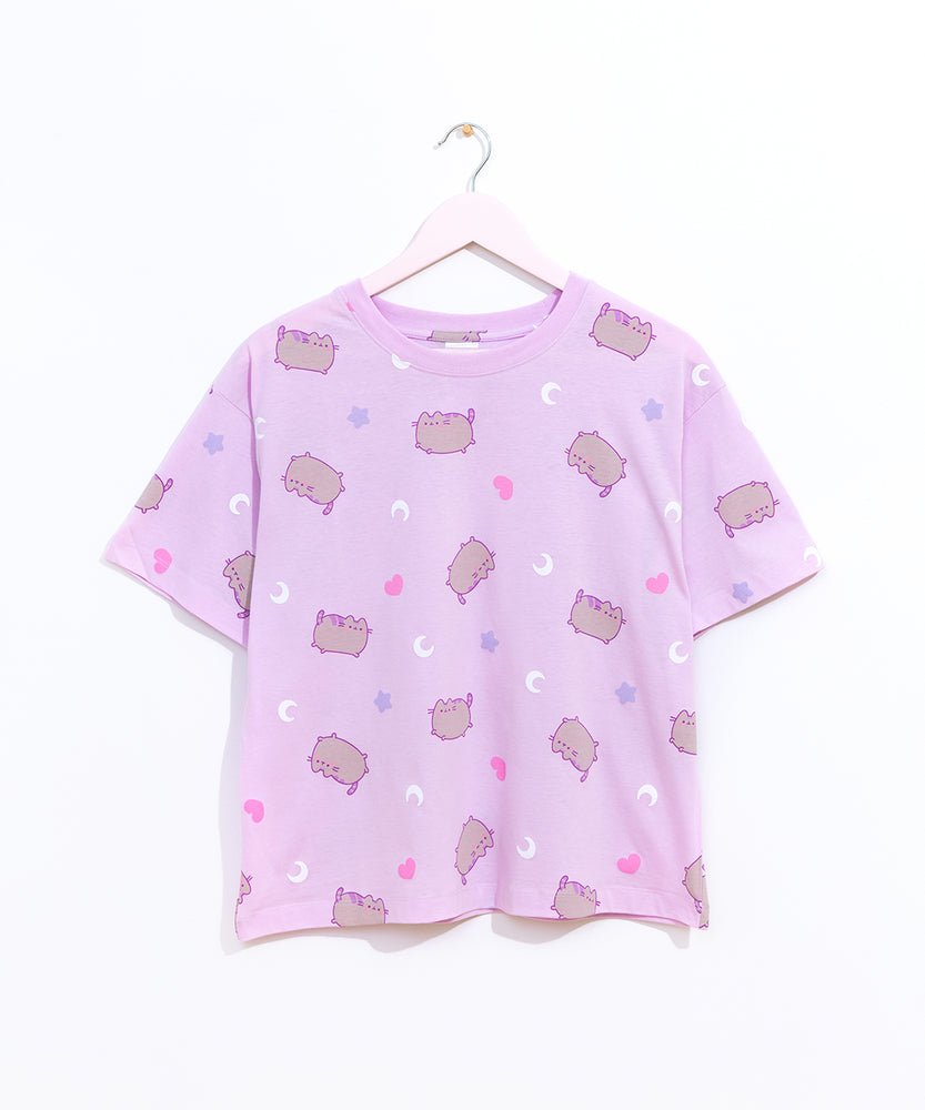 The light purple relaxed fit pajama top hangs on a light pink hanger to show the silhouette of the lounge top.