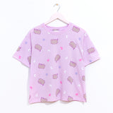 The light purple relaxed fit pajama top hangs on a light pink hanger to show the silhouette of the lounge top.