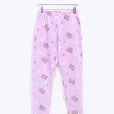 The light purple tapered pajama bottoms hang on a white hanger to show the silhouette of the lounge pants, the location of the side pockets, and the tapered cuffs..