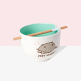 Interior view of the Very Hungry Ramen Bowl to show interior color of the bowl. The interior color of the white bowl is a teal color. The included chopsticks are shown lying in the designated notches in the bowl. 