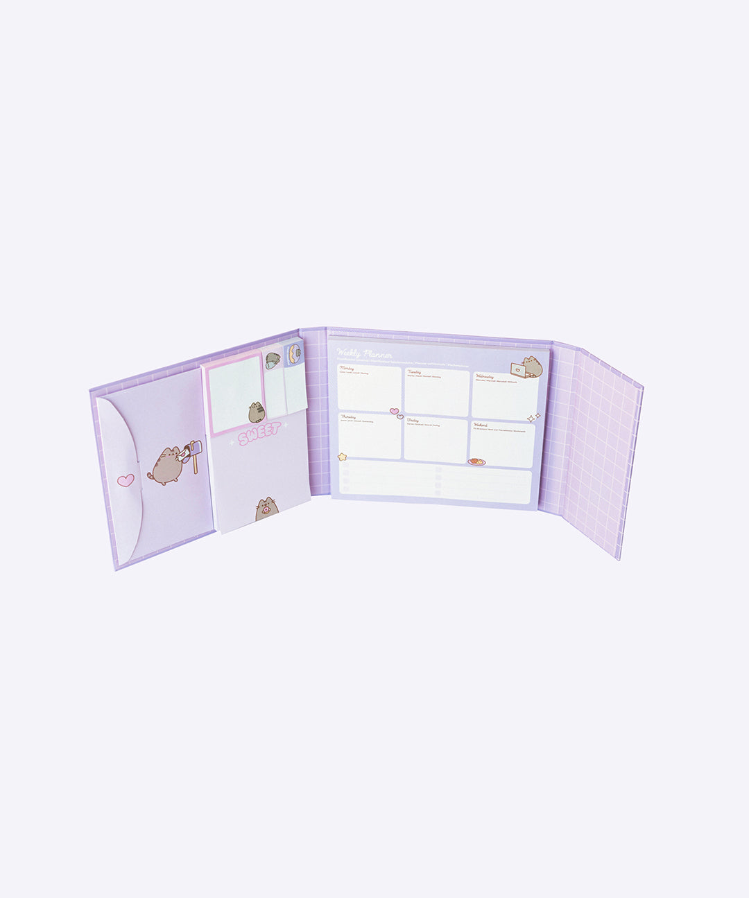 Interior of the purple Pusheen Weekly Planner Binder. Inside the binder is an envelope slot, square sticky notes, small rectangular sticky notes, a notepad, and a week-at-a-glance calendar for planning. 