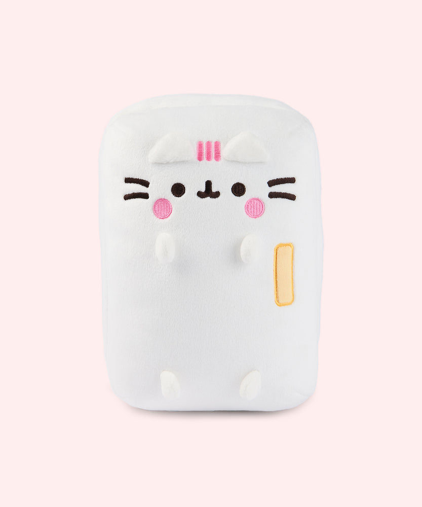 Front view of the Pusheen's Kitchen Refrigerator Plush. The white rectangular plush features Pusheen as a refrigerator with a yellow handle. Pusheen's blush and three head stripes are embroidered in a pink color while her eyes, mouth, and whiskers are embroidered in a dark brown color towards the top of the rectangular plush.