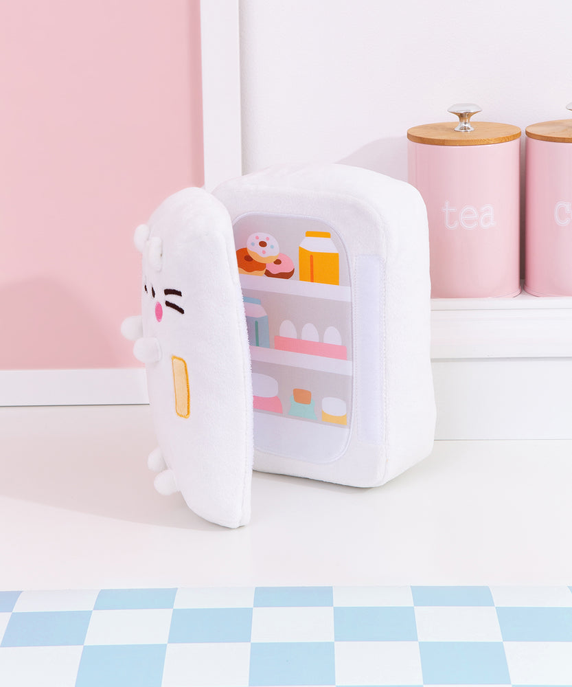 Partial interior view of the fridge plush. The plush opens to reveal a printed stocked fridge of Pusheen's favorite snacks. Included in the interior prink are milks, donuts, eggs, and more!