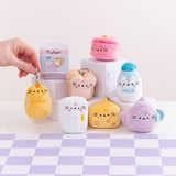 Model holds the lobster clip of the honey jar keychain plush. Each mini plush has a lobster clip keychain so the plush can be attached to backpacks, purses, and more. 