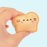 Model squishy the bread slice in the Kitchen Surprise Squishy. The water-filled squishy has a soft and squeezable texture.