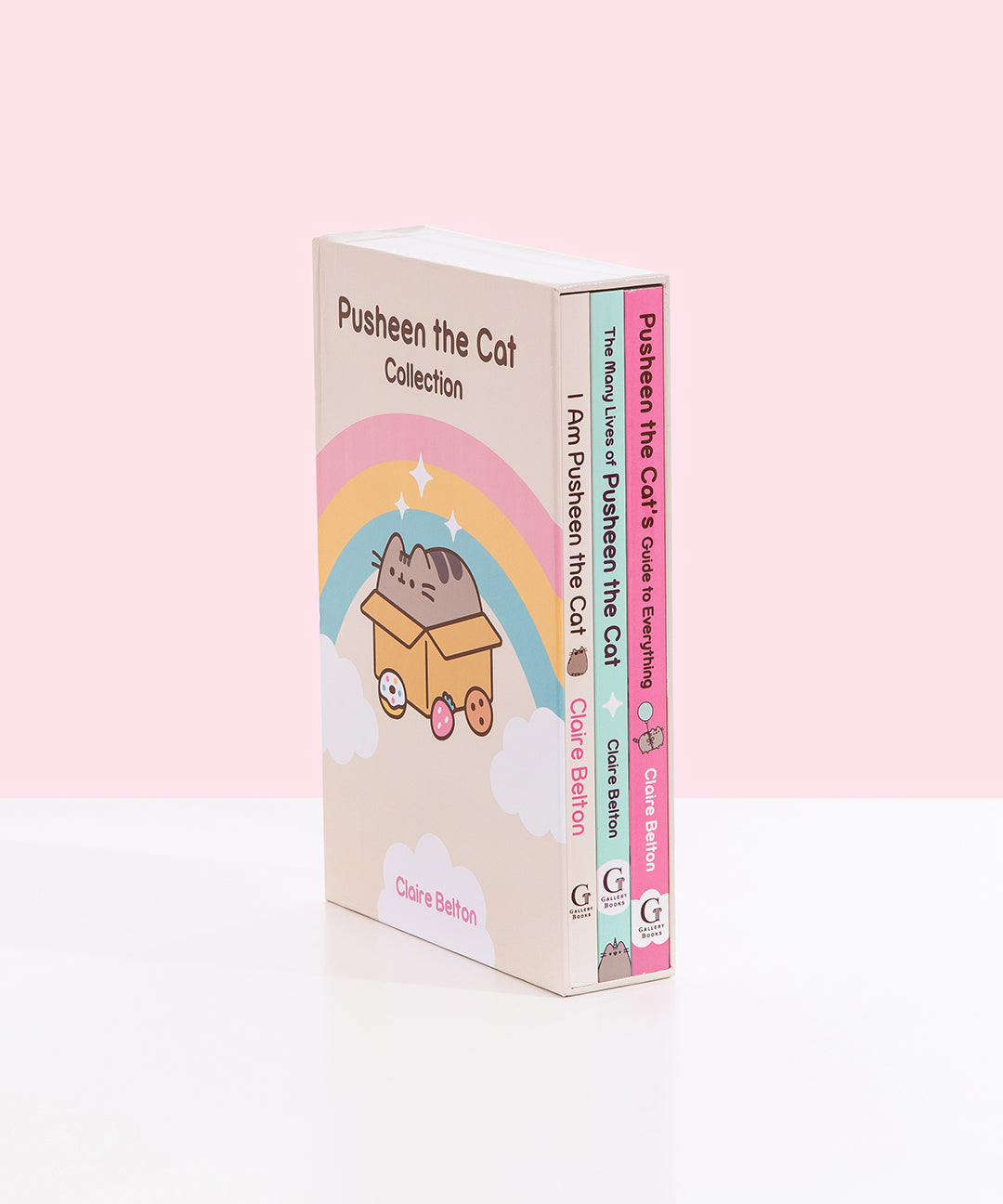Side view of the 3-Book Boxed Set showcasing the books fitting inside the decorative box. All three paperback books are held inside the box to show the spine graphics of each book. 
