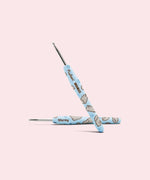 Close-up of the custom crochet hook. The light blue handle features an all over print of Pusheen's sister Stormy and the Pusheen x The Woobles collaboration logo.