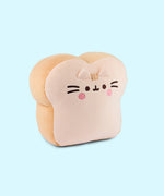Back view of the Pusheen's Kitchen White Bread Squisheen Plush. The back of the bread slice plush features Pusheen's two back stripes that matches the light-brown color of the side of plush. Towards the bottom of the plush is Pusheen's striped tail alternating the colors of light cream and light brown.
