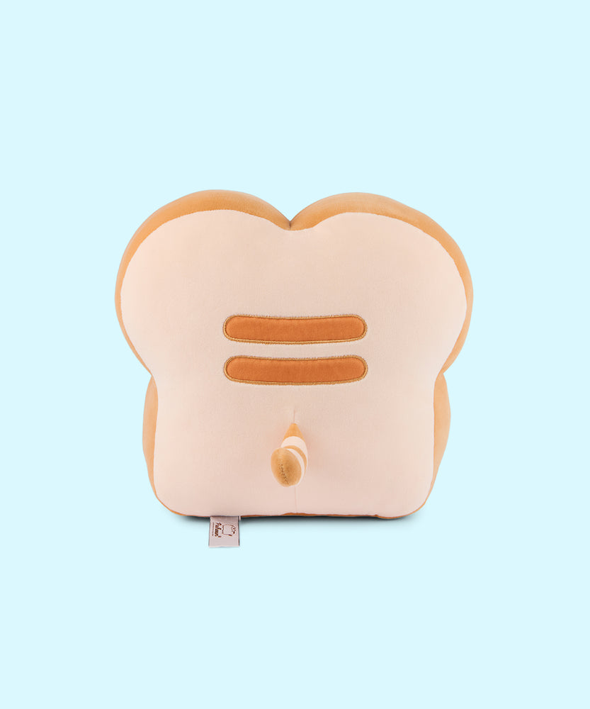 Back view of the Pusheen's Kitchen White Bread Squisheen Plush. The back of the bread slice plush features Pusheen's two back stripes that matches the light-brown color of the side of plush. Towards the bottom of the plush is Pusheen's striped tail alternating the colors of light cream and light brown.